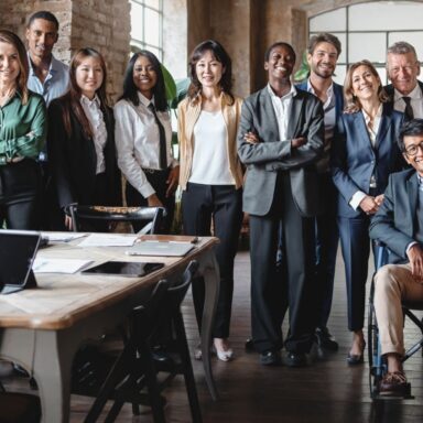 Group of multiethnic business people portrait in the office - Kirk Miller